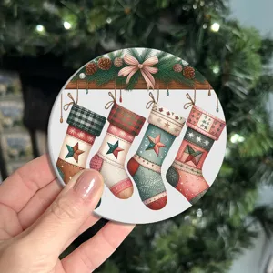 Close up of the round Christmas printed coaster detail, showing vibrant festive stocking motif.