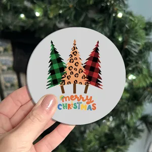 Christmas car coaster with cute tree pattern, festive cup holder insert mat for auto interior decor.