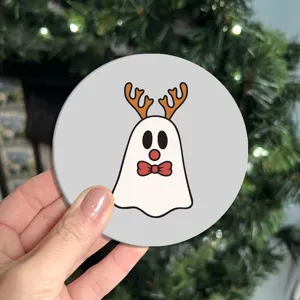 Cute ghost reindeer car coaster detail shot, non-slip cup holder mat for vehicle interior.