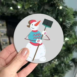 Detailed view of a round cartoon snowman printed PVC cup coaster showing fine holiday design.