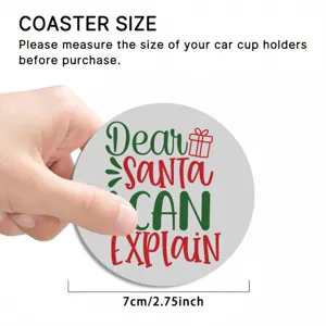 Close up view of a round silicone car coaster featuring Christmas text design and hand display.