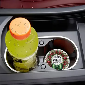 Christmas car cup coaster detail view, showing the festive wreath design inside a vehicle holder.
