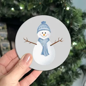 Close-up detail view of a cute watercolor snowman round car coaster, soft rubber.