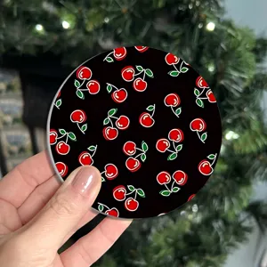 Close-up detail of the cute cherry pattern car coaster, non-slip silicone interior accessory.