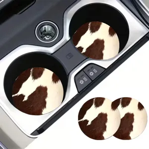 Detailed close-up view of cow print car cup coasters, anti-slip silicone insert pads.