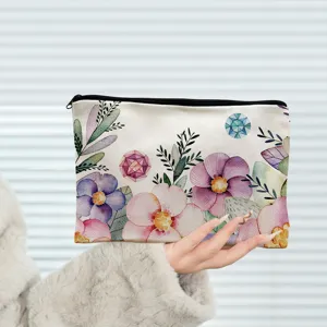 Borsa cosmetica in tela con fiori ad acquerello e zip nera, astuccio per il trucco quotidiano.