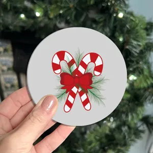 Detailed view of a festive Christmas candy cane printed car coaster, ideal for auto cup holders.