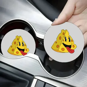 Close-up view of a cute cartoon cheese car cup coaster placed neatly inside a vehicle cup holder.