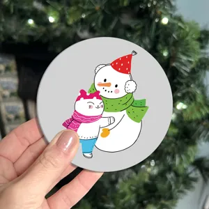 Cute cartoon cat and snowman PVC coaster detail, flexible waterproof cup mat for car and home desk.