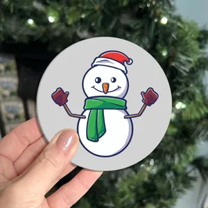 Close-up detail shot of a cute Christmas snowman coaster, perfect for holiday home decor.
