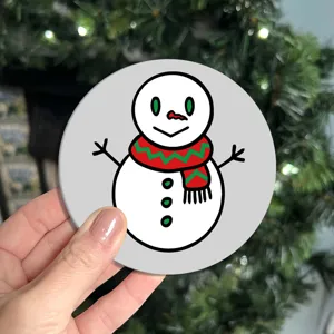 Christmas snowman design car coaster detail view, festive table mat and holiday decor piece.