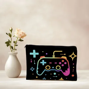 Detail view of black cosmetic pouch featuring colorful game controller print, zipper closure.
