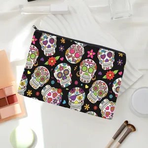 Detailed view of the black sugar skull print cosmetic bag, showing unique design and zipper.