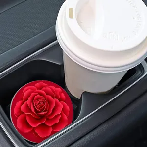 Car cup coaster detail showing beautiful red rose design in vehicle holder slot.
