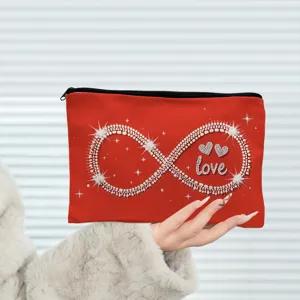 Red cosmetic zipper bag detail featuring sparkling infinity and love heart print design.