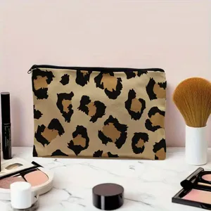 Canvas cosmetic bag featuring trendy leopard print design, portable travel makeup pouch for women and students.
