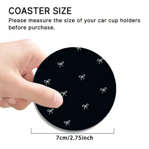 Black car cup coaster with white bow pattern, 7cm diameter anti-slip silicone auto mat.