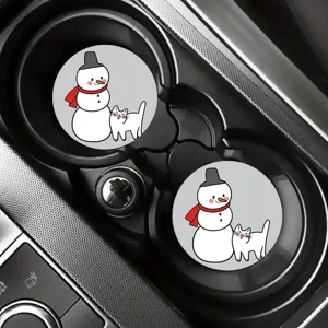 Close-up of cute cartoon snowman coasters fitted perfectly in car cup holders for interior display.