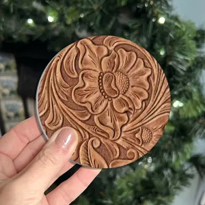Round anti-slip car coaster with carved floral leather pattern, heat resistant coffee mat.