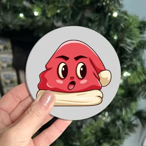 Close-up detail of the cute cartoon red character silicone coaster, showing non-slip and texture.