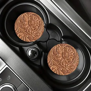Car coaster detail view showcasing vintage floral carved leather texture inside cup holder.