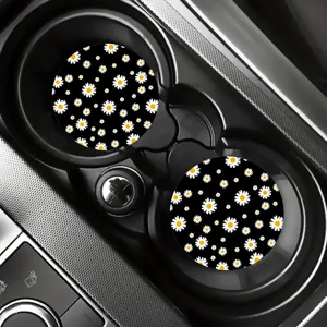 Non-slip car cup coasters with black background and white daisy floral pattern for auto.