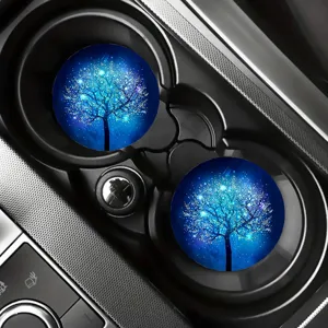 Detail shot of blue glowing tree pattern car cup coasters, anti-slip silicone interior auto drink mat.
