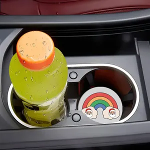 Car cup holder mat detail view showing non-slip festive Christmas Santa rainbow design installed.