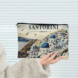 Detail shot of a Santorini Greece printed makeup pouch, featuring a vibrant scenic design.