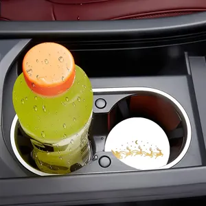 Detailed close-up view of car cup holder coaster featuring elegant gold reindeer holiday print.