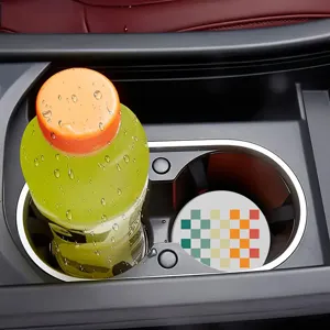 Detail view of non-slip silicone car cup coaster with colorful gradient square pattern in holder.