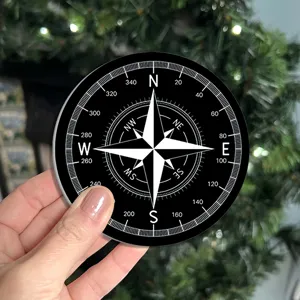 Round black and white compass pattern decorative coaster or mat, stylish modern home decor.