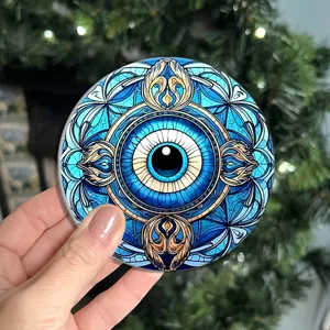 Close-up of a round blue evil eye mandala pattern coaster, anti-slip heat insulation pad.