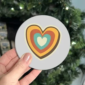 Silicone coaster with retro multi-colored heart design, anti-slip table mat for home use.