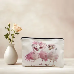 Detailed view of the canvas cosmetic bag featuring cute flamingo print, presented with rose.