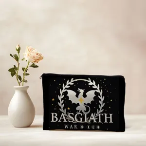 Close-up of black canvas cosmetic bag with dragon print and Basgiath War text detail.