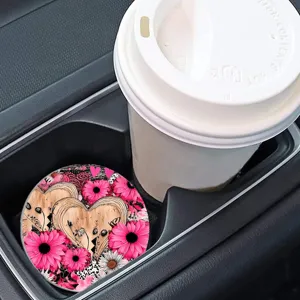 Car cup coaster detail view featuring a heart and pink daisy pattern in a vehicle holder.