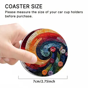 Close-up detail of a colorful floral mosaic car coaster, showing size and texture clearly.