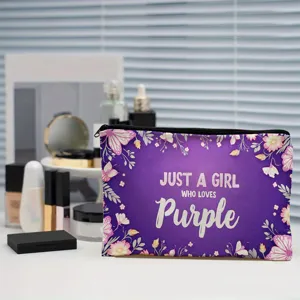 Detail shot of purple makeup pouch with floral butterfly print and English text quote.
