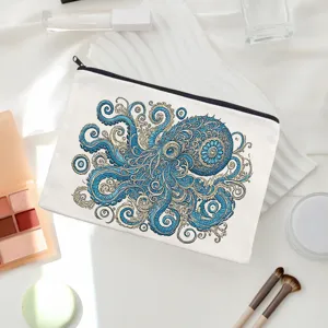 Detailed view of white canvas makeup pouch featuring intricate blue octopus art design.