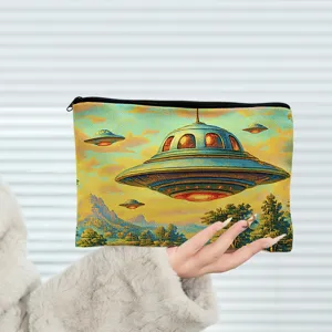 Detail view of a retro UFO print cosmetic pouch, zipper closure, daily travel makeup storage bag.