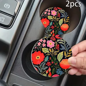 Round silicone car cup coaster with elegant floral pattern, non-slip design for vehicle interior.