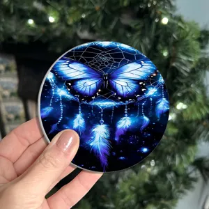 Round car cup coaster with blue butterfly dreamcatcher pattern, anti-slip heat insulation.
