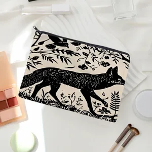 Black and white fox print cosmetic bag, canvas makeup pouch detail view for travel.