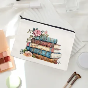 Detailed view of white canvas makeup pouch featuring elegant vintage book and floral watercolor print.