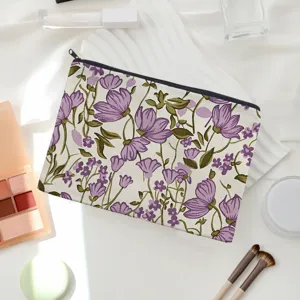 Detail view of floral canvas cosmetic bag with purple flowers, perfect for travel and storage.