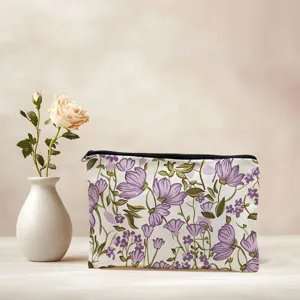 Canvas cosmetic bag detail, featuring elegant purple floral pattern, portable storage design.
