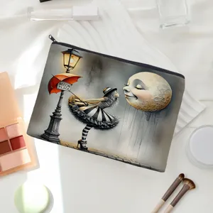 Detailed view of canvas makeup pouch with artistic moon illustration and smooth zipper.