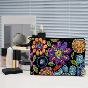 Close-up detail shot of colorful mosaic floral pattern zipper cosmetic pouch storage bag.