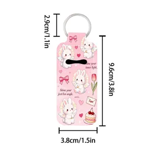 Pink neoprene lipstick holder keychain with cute angel bunny print and dimension specs.